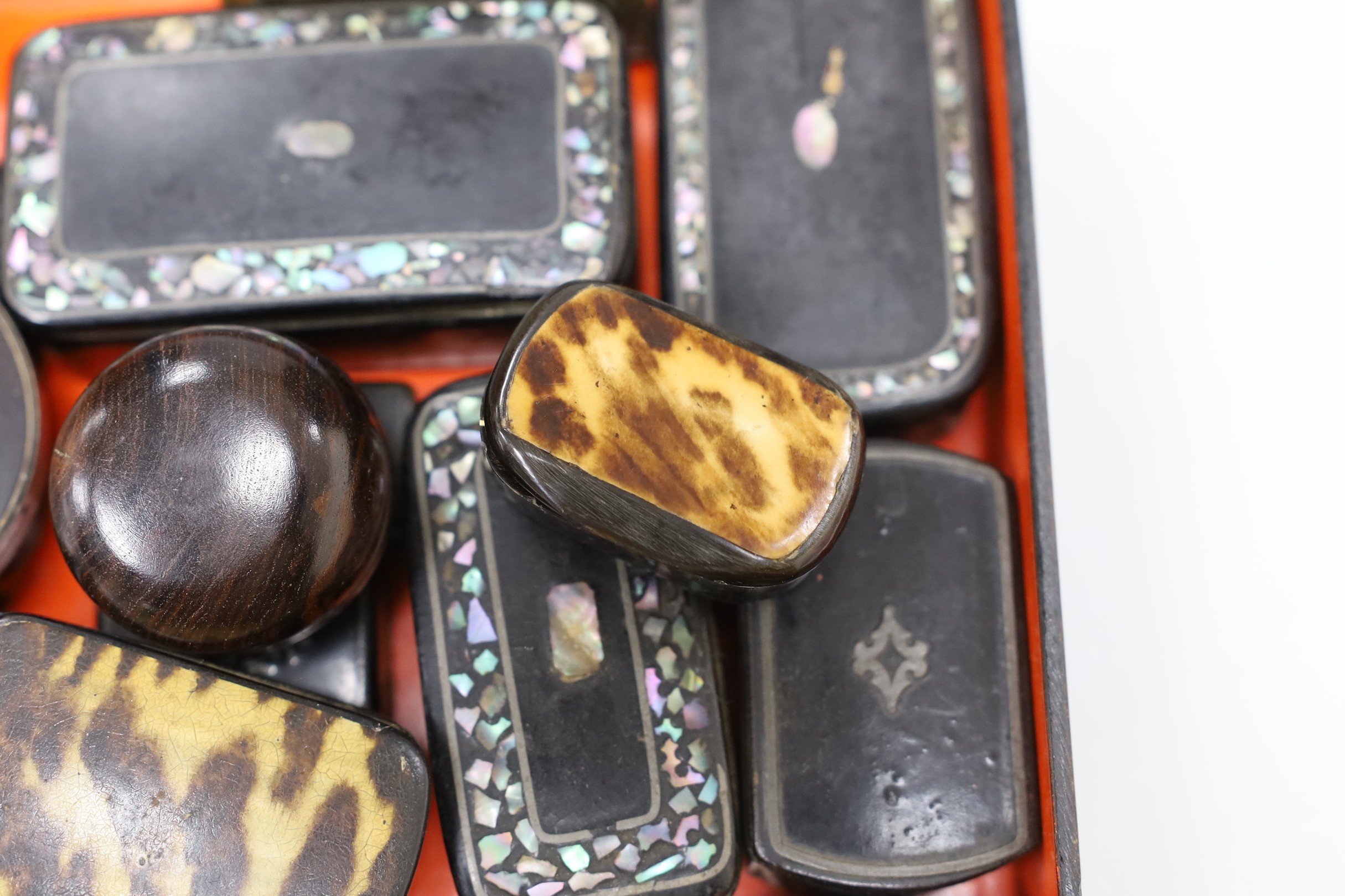 A collection of Victorian papier mache snuff boxes and a Tunbridge ware pin wheel
